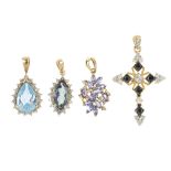 A selection of four diamond and gem-set pendants. To include a diamond and black-gem cross