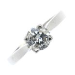 A platinum diamond single-stone ring. The brilliant-cut diamond, to the tapered band. Estimated