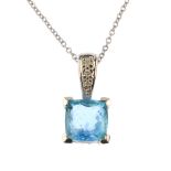 A group of topaz jewellery. The pendant designed as a cushion-shape blue topaz with brilliant-cut