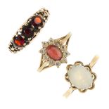 A selection of six gem-set dress rings. To include an opal single-stone ring, a sapphire three-stone