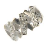 A diamond dress ring. Designed as a series of stylised crosses, each with brilliant-cut diamond line