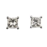 A pair of 18ct gold square-shape diamond single-stone ear studs. Estimated total diamond weight 0.