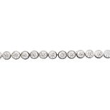 (126643) An 18ct gold diamond line bracelet. Comprising a series of thirty-three brilliant-cut