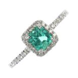 * An emerald and diamond cluster ring. The rectangular-shape emerald, within a brilliant-cut diamond