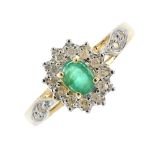 A 9ct gold emerald and diamond cluster ring. The oval-shape emerald, within a brilliant-cut