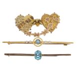 A selection of three early to mid 20th century gold brooches. To include a 15ct gold aquamarine