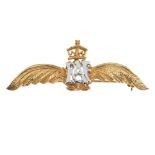 A 9ct gold RAF brooch. The RAF initial monogram, with crown surmount, to the textured wings.