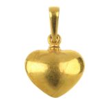 A heart pendant. The heart-shape pendant, to the detachable, tapered surmount. Length 2.3cms. Weight