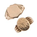 Two early 20th century 9ct gold signet rings. To include an oval panel ring with initial monogram