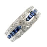 A 14ct gold sapphire and diamond dress ring. The brilliant-cut diamond cross, set atop the