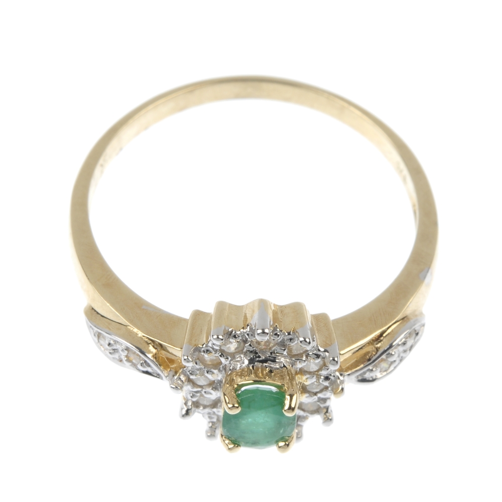 A 9ct gold emerald and diamond cluster ring. The oval-shape emerald, within a brilliant-cut - Image 2 of 2