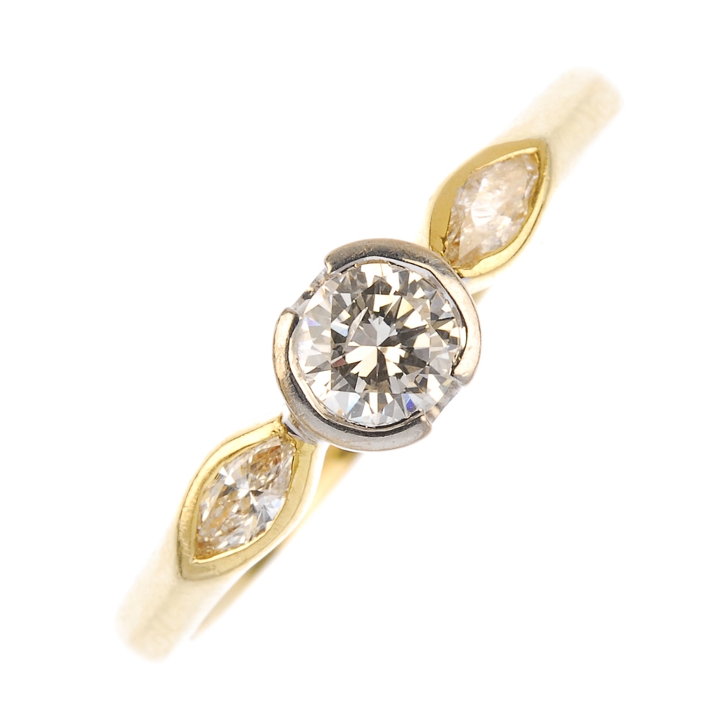 An 18ct gold diamond single-stone ring. The brilliant-cut diamond, within a partial collet