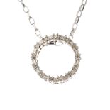 A diamond wreath pendant. The alternating baguette and single-cut diamond circle, suspended from a