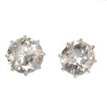 A pair of old-cut diamond single-stone ear studs. Estimated total diamond weight 1.20cts, I-J