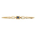 A sapphire bar brooch. Of openwork design, the oval-shape sapphire collet, to the geometric bar.