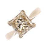 (126643) An 18ct gold diamond single-stone ring. The rectangular-shape diamond, to the plain band.