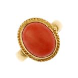 A coral single-stone ring. The oval coral cabochon, within a rope-twist collet mount, to the plain