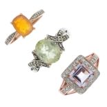 A selection of three 9ct gold gem-set rings. To include an amethyst and colourless-gem cluster ring,