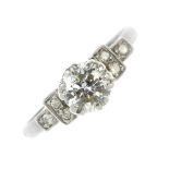 A mid 20th century platinum diamond single-stone ring. The brilliant-cut diamond, to the single-