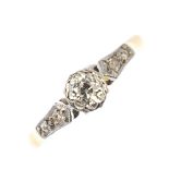 A mid 20th century 18ct gold and platinum diamond single-stone ring. The old-cut diamond, with