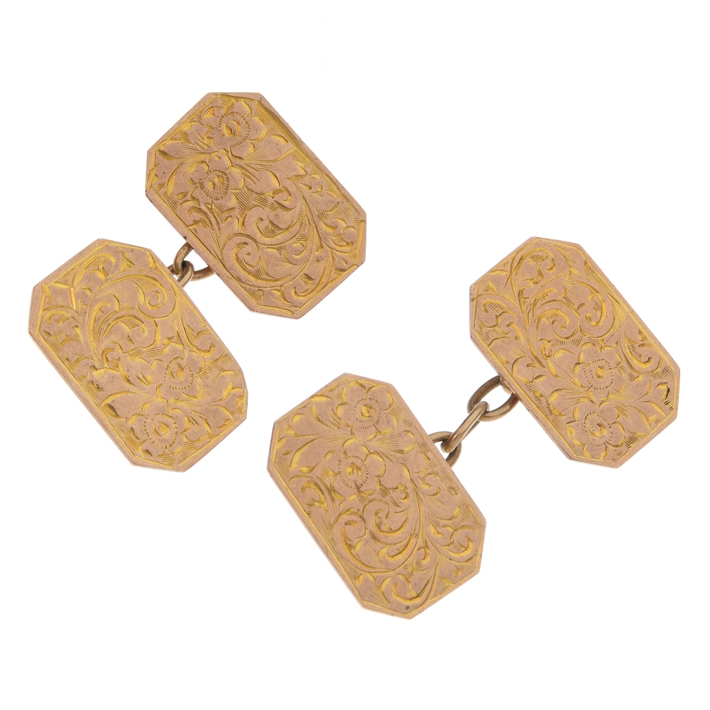 Two pairs of 9ct gold cufflinks. To include a pair of early 20th century rectangular-shape scroll