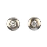 A pair of 18ct gold diamond earrings and a pair of paste ear studs. Each of the first pair