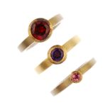 A selection of three gem-set single-stone rings. To include an 18ct gold amethyst ring, together