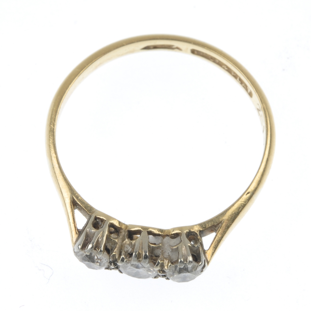 A mid 20th century 18ct gold and platinum diamond three-stone ring. The circular-cut diamonds, to - Image 2 of 2