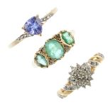 A selection of three 9ct gold gem-set rings. To include a diamond cluster ring, an emerald and