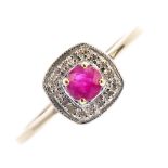 A 9ct gold ruby and diamond cluster ring. The circular-shape ruby, within a single-cut diamond