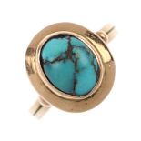 A mid 20th century 14ct gold turquoise single-stone ring. The oval turquoise cabochon, within a