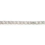 (172714) An 18ct gold diamond line bracelet. The brilliant-cut diamond, illusion-set line, to the