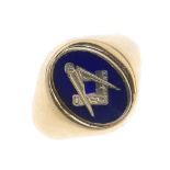 A 9ct gold Masonic ring. The oval-shape swivel panel, with blue enamel Masonic symbol, to the