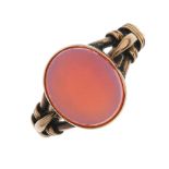 A gentleman's late Victorian 9ct gold sardonyx ring. The oval-shape sardonyx, to the trifurcated