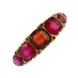 A late Victorian 18ct gold five-stone gem-set ring. The replacement cushion-shape garnet and