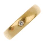 An 18ct gold diamond ring. The plain band, with brilliant-cut diamond inset. Estimated diamond