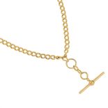 An early 20th century 18ct gold double Albert chain. The curb-link chain, suspending a T-bar, to the