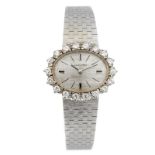 LONGINES - a lady's bracelet watch. Stamped 18K 0,750. Signed manual wind calibre 460. Silvered dial