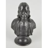 A 20th century Wedgwood black basalt bust of John Wesley, raised upon circular socle base, marked '