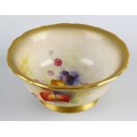 A Royal Worcester porcelain bowl painted by Kitty Blake. Having a wavy-edged spray-gilt rim,