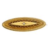 A late 19th century gold diamond memorial brooch. The old-cut diamond, inset to the marquise-shape