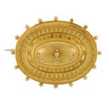 A late Victorian 15ct gold memorial brooch. The oval raised dome, with bead and rope-twist