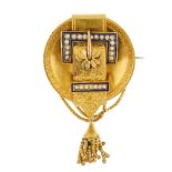 A late 19th century 15ct gold split pearl and enamel memorial brooch. The scroll engraved buckle,