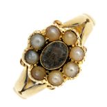 An early 20th century 18ct gold split pearl memorial ring. The oval-shape glazed woven hair panel,