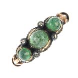 A late 19th century 9ct gold cabochon emerald and rose-cut diamond three stone ring. The cabochon