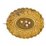 A late 19th century 18ct gold split pearl memorial brooch. The split pearl floral panel, within a