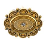 A late Victorian 18ct gold and diamond memorial brooch. The old-cut diamond to the cannetille and