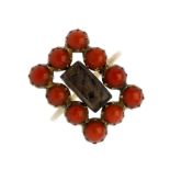 A late 19th century coral memorial ring. The glass woven hair panel, within an oblong-shape coral