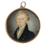 A late 19th century portrait miniature pendant. The circular portrait, painted to depict a