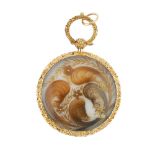 A mid 19th century mourning pendant. Of circular outline, the engraving depicting a coastal scene,